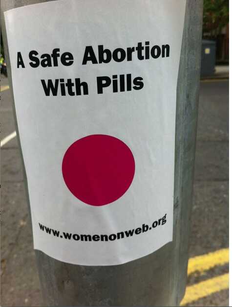 Poster safe abortion with pills on street